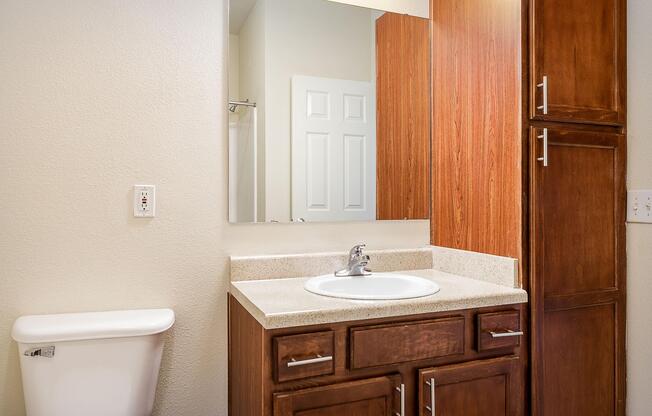 a kitchen with a sink and a mirror