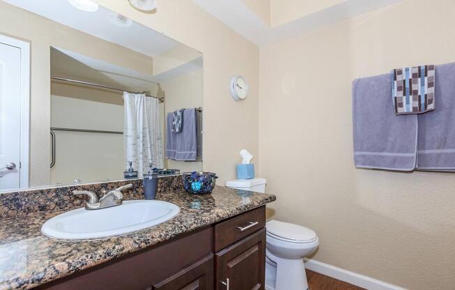 a kitchen with a sink and a mirror