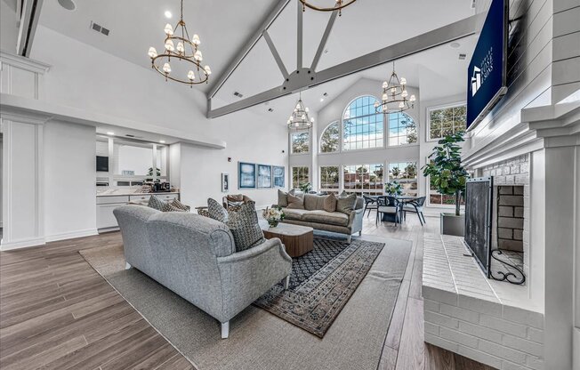 a large living room with couches and a fireplace