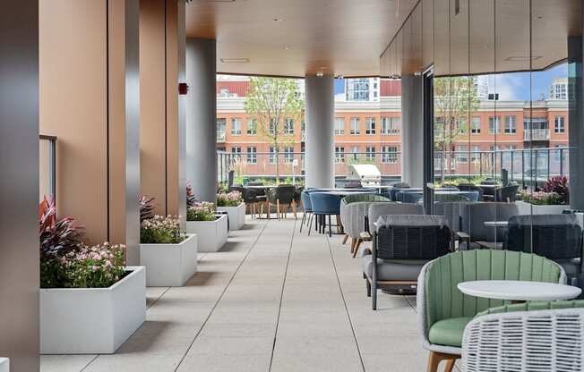 a large patio with tables and chairs and large glass walls  at Cassidy on Canal, Chicago, Illinois