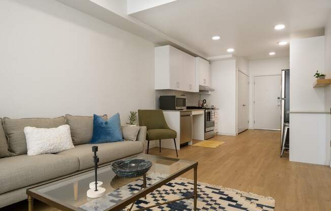 a living room with a couch and a coffee table at The Lucy Boise Apartments, Boise, Idaho