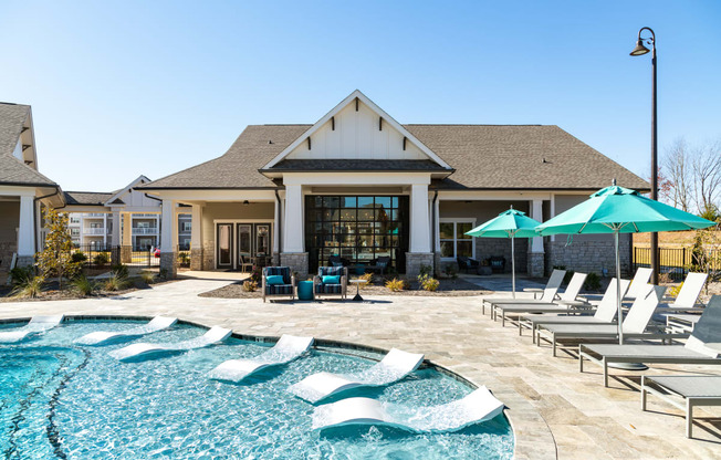 Resort style swimming pool with lounge chairs area at The Alexandria in Madison, AL