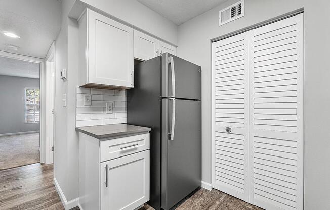 a white refrigerator freezer sitting inside of a kitchen