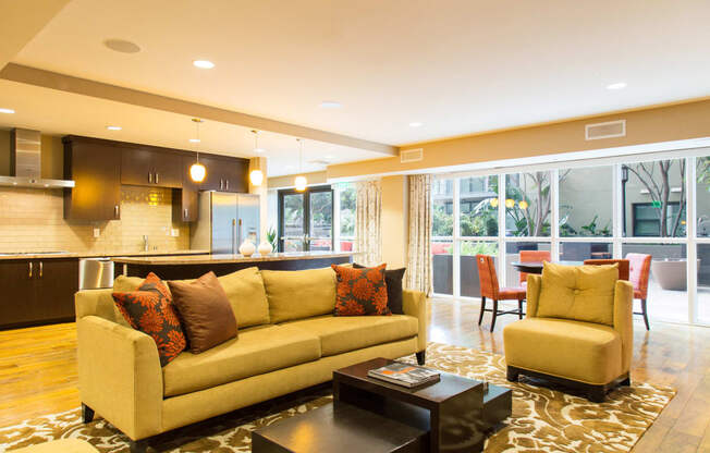 Apartments for Rent in Irvine - Astoria at Central Park West Lobby Sofa, Coffee Table and Open Kitchen Area