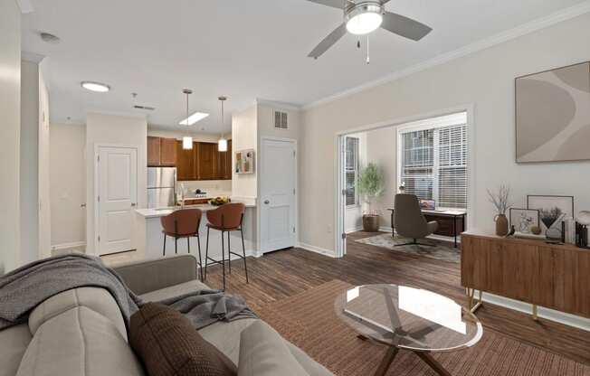 a living room with a couch and a glass table