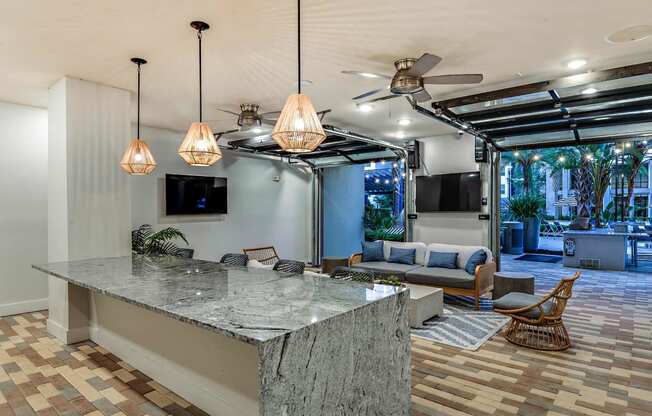 a kitchen with a counter top and a living room