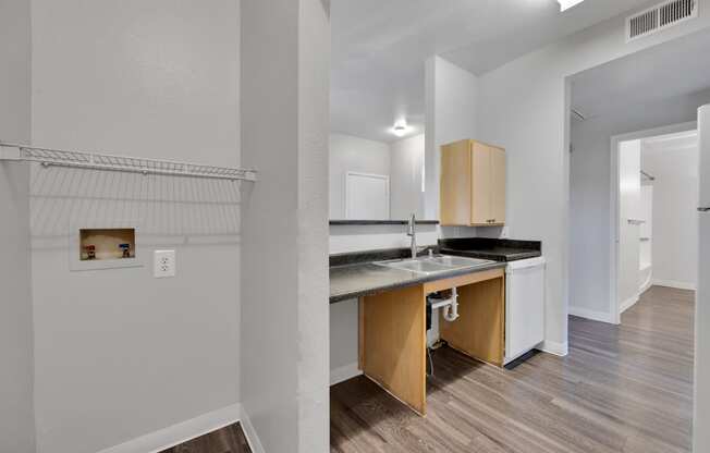 a kitchen with a sink and a counter top in a renovated apartment