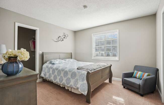 Bedroom with a bed and a chair and a window  at Cape Landing, Myrtle Beach, South Carolina