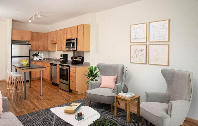 A modern kitchen with a dining table and chairs.