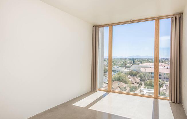 a view of a bedroom next to a window