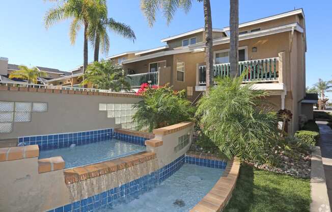 Display of multi-level waterfall at property entrance