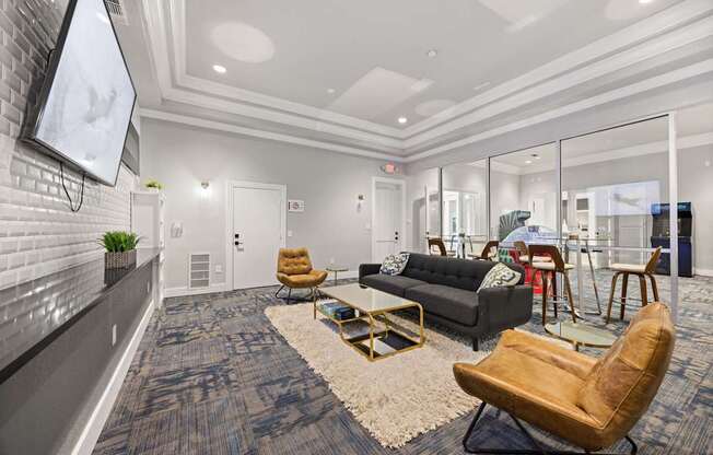 A modern living room with a grey carpet and a wooden chair.