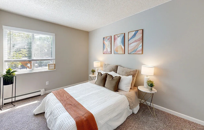 Comfortable and stylish bedroom with soft lighting and modern finishes at Glen Ridge Apartments.