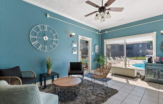 a living room with a large clock on the wall