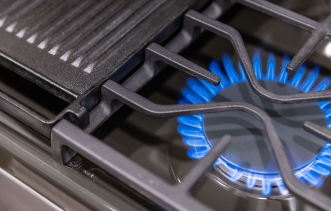 a blue flame on a gas stove