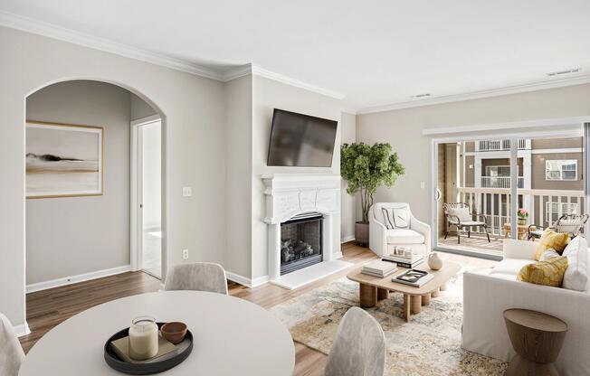 Open living and dining area with balcony access, abundant natural light, and a fireplace available in select homes for added warmth and character.