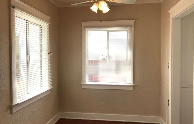 South Park Cottage-1BR 1BA-Freshley Painted-Wood Floors-Crown Molding-Ceiling Fans-Parking-Fenced Front Yard