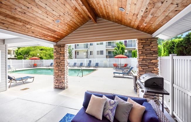 the preserve at ballantyne commons pool and patio with furniture and a grill