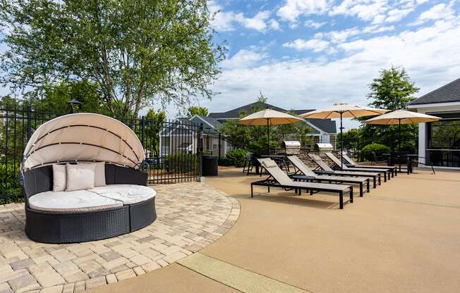 A sun lounger area with a circular sunbed in the middle.