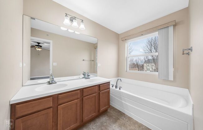 AUTUMN CREEK SECOND FLOOR CONDO WITH TWO CAR GARAGE