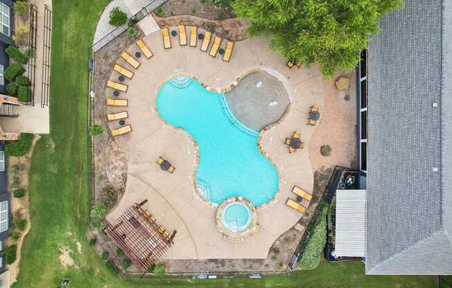 A large outdoor pool with a sign that says "MUJIN".