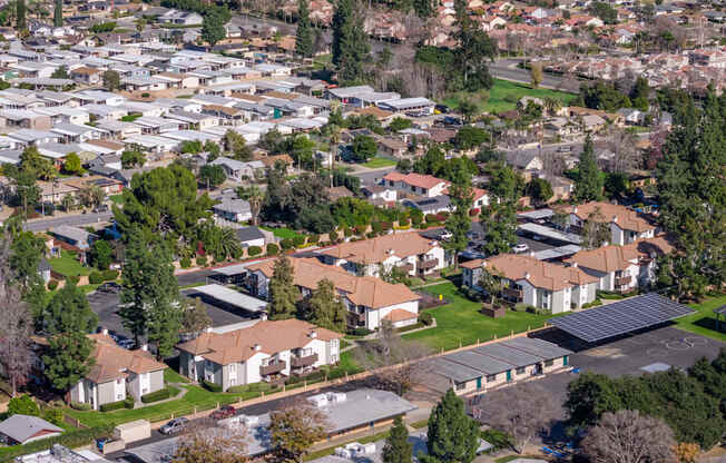 A residential area with houses and trees.