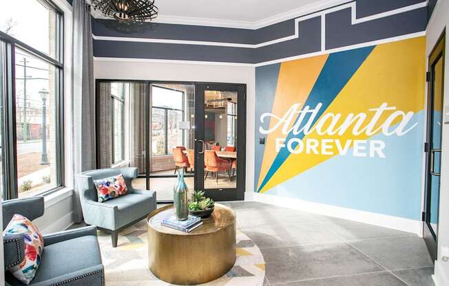 A living room with a large wall mural that says