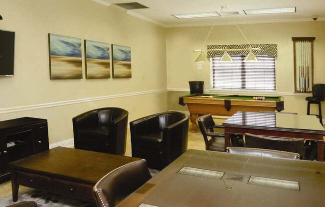community center with tables and chairs, TV and pool table at Heatherwood House at Patchogue, Patchogue