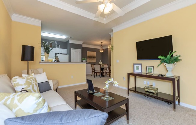 Living room with sofa and tv at Wynnewood Farms Apartments, Overland Park, 66209