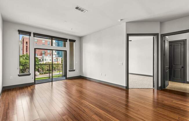 A room with a wooden floor and white walls.