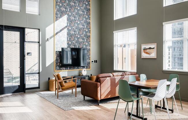 a living room with a couch and a table and a tv