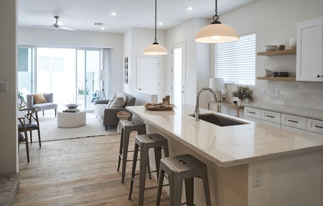 a large kitchen with a center island and bar stools at Novella Biltmore, Phoenix Arizona