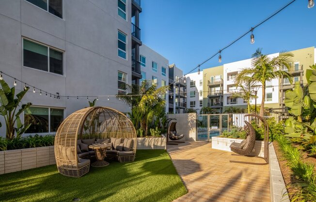 an apartment with a backyard and a pool