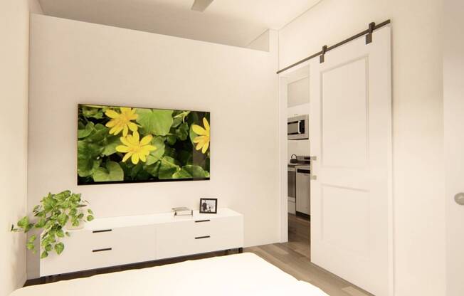 a white bedroom with a painting of yellow flowers on the wall at Brownstones at Palisade Park Townhomes, Colorado, 80023