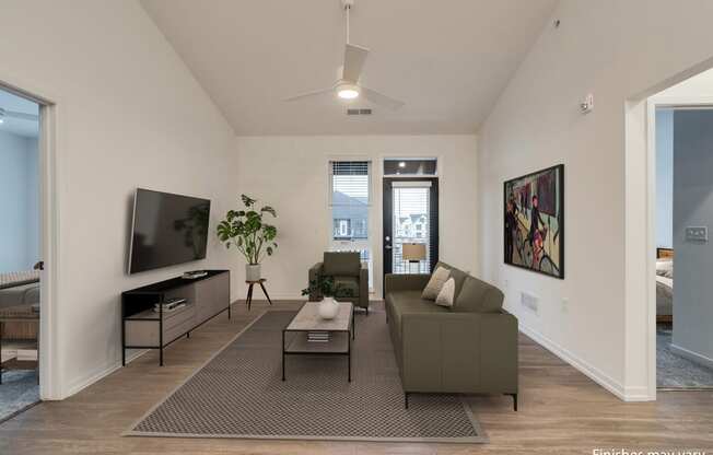 a living room with a couch and a coffee table in front of a tv