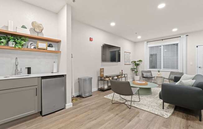 an open living room with a kitchen and a dining room at Switchback on Platte Apartments, Littleton, 80120