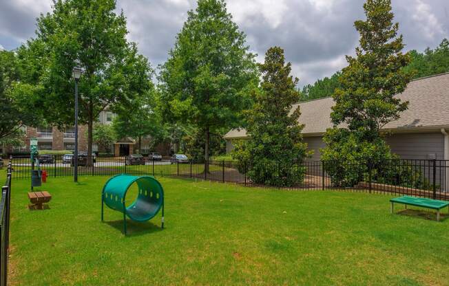 our apartments have a park with a playground and a green slide