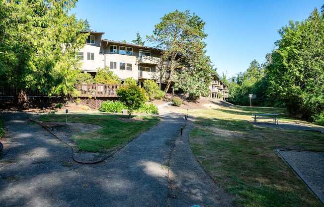 Apartment pathway with buildings and green trees