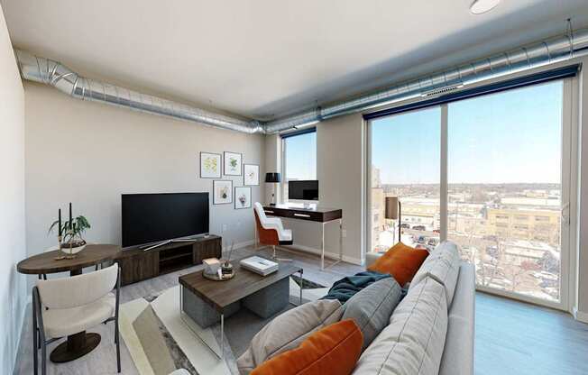 a living room with a large window and a view of a city