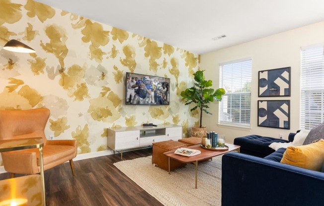 a living room with a couch and a coffee table at Residences at Stevens Pond, Saugus, MA