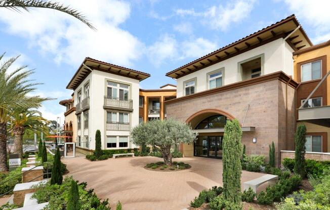 a courtyard with a tree in the middle of it