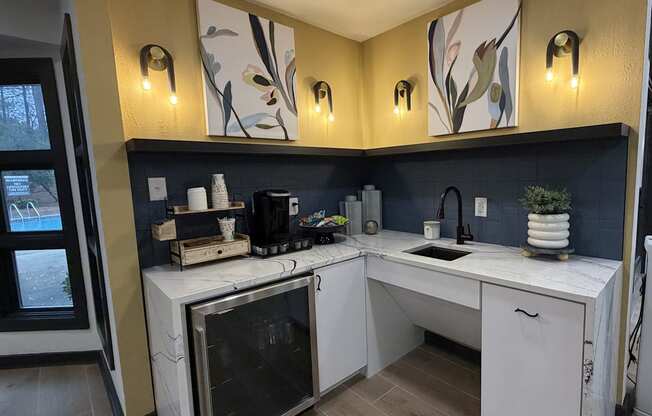 A kitchen with a white counter and a black oven.