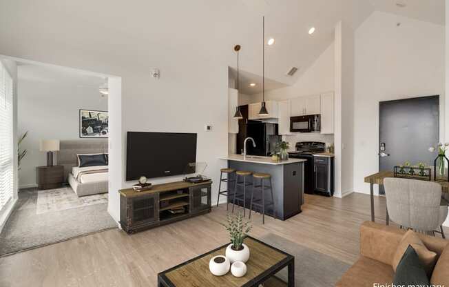 a view of the living room and kitchen from the dining area