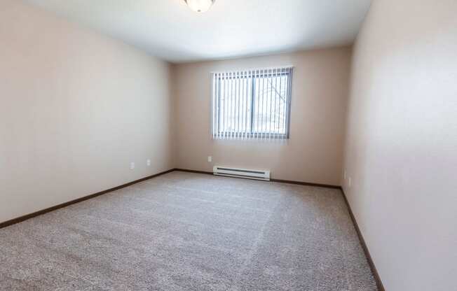 Grand Forks, ND Library Lane Apartments a large empty room with a window