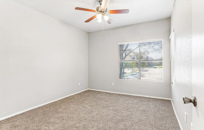 Quiet bedroom with large windows at Laurels of Sendera apartments in Arlington, TX