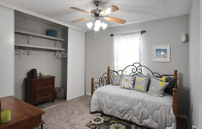 spacious bedroom with large closet and ooverhead lighting