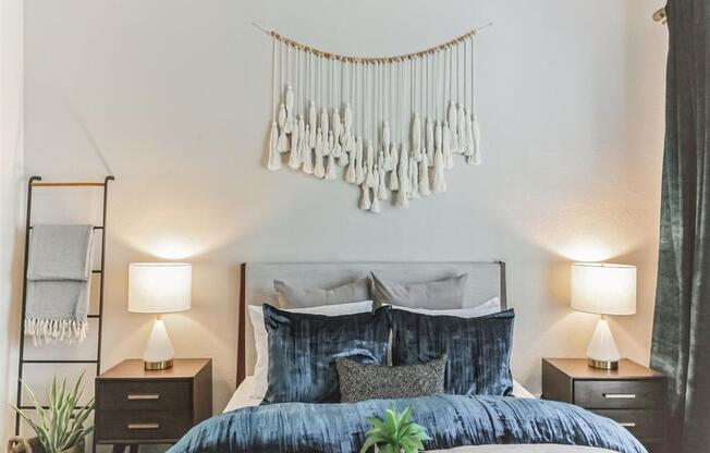 a bedroom with a bed and a decoration on the wall