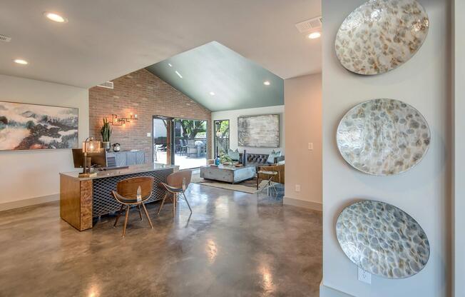 a living room filled with furniture and a table