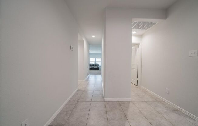 Enjoy open living with a kitchen featuring a breakfast bar sink island, gas range, and walk-in pantry. Relax in a master suite with a 5-foot shower and walk-in closet, plus a private backyard with covered patio and 6-foot fence.