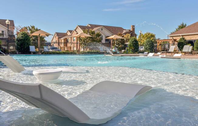 Relaxing pool lounges at Avenues at Craig Ranch apartments for rent in Dallas, TX